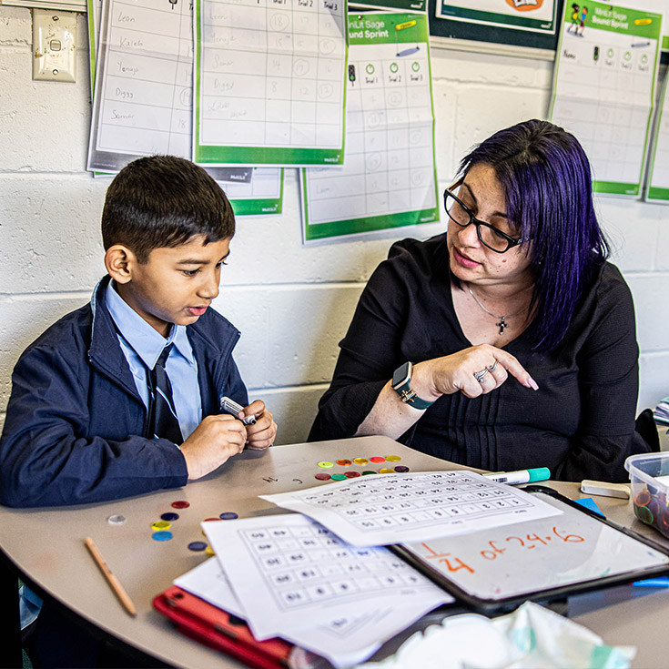 Teacher supporting student at St Patrick's Catholic Primary Blacktown